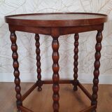 Round wooden table with beaded legs