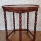 Round wooden table with beaded legs