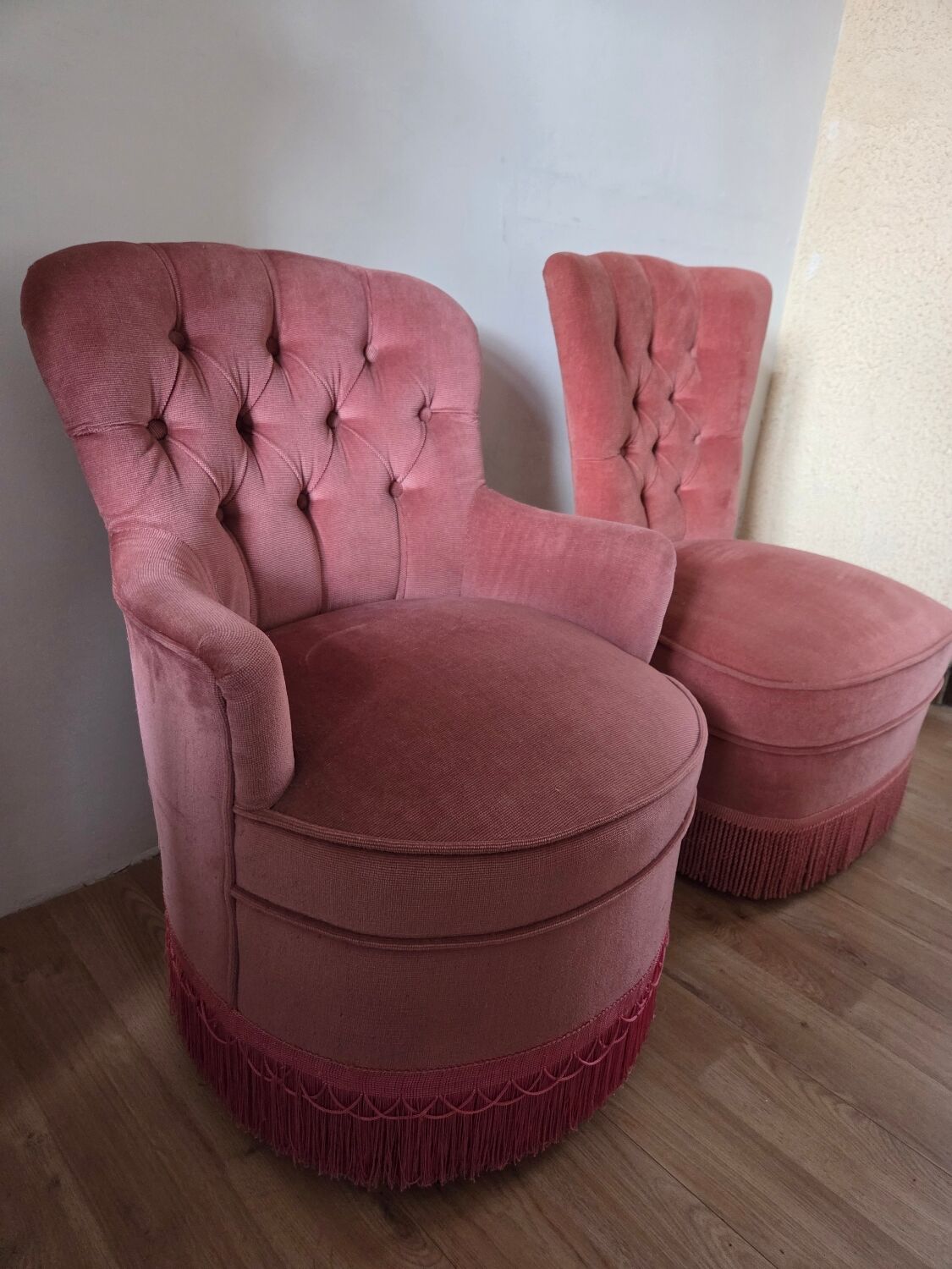 A pair of small tub chairs.