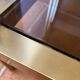 Regency style console table, in gilded metal and smoked glass