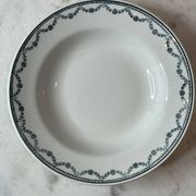 Set of 12 deep plates Saint Amand with floral garland decoration.