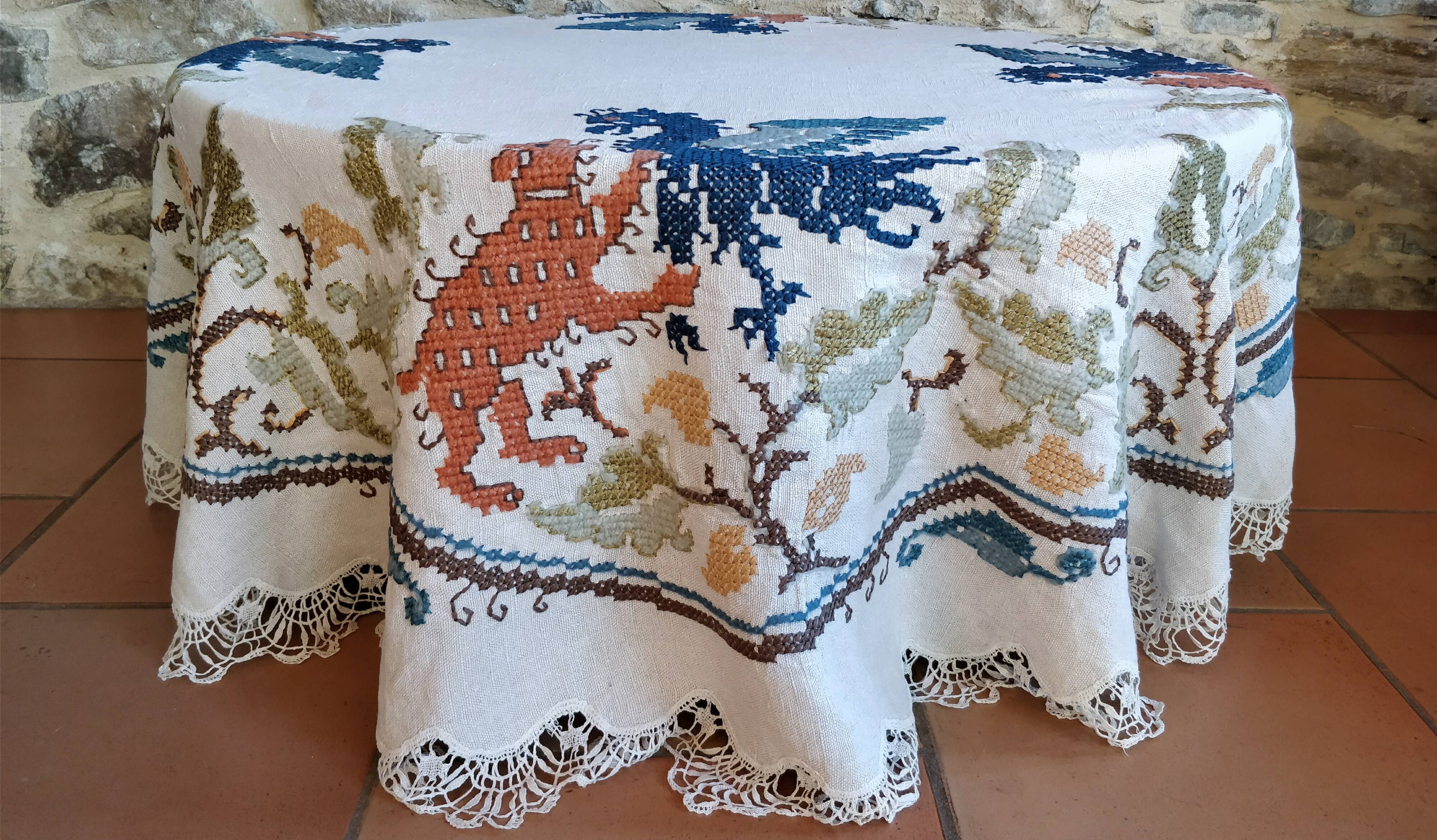 Round embroidered linen tablecloth