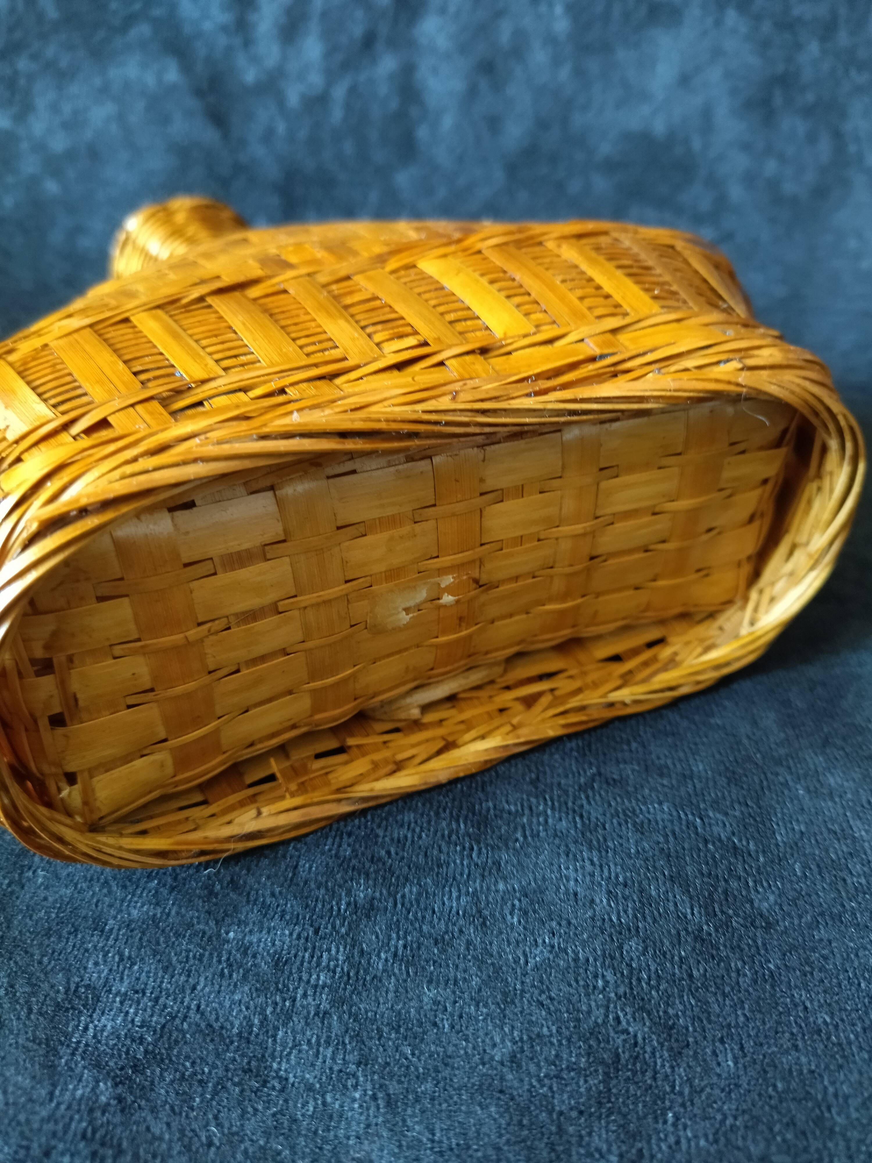 Vintage wicker and braided bamboo bottle
