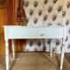 Antique wooden sloped desk, with a drop-down front and turned legs.