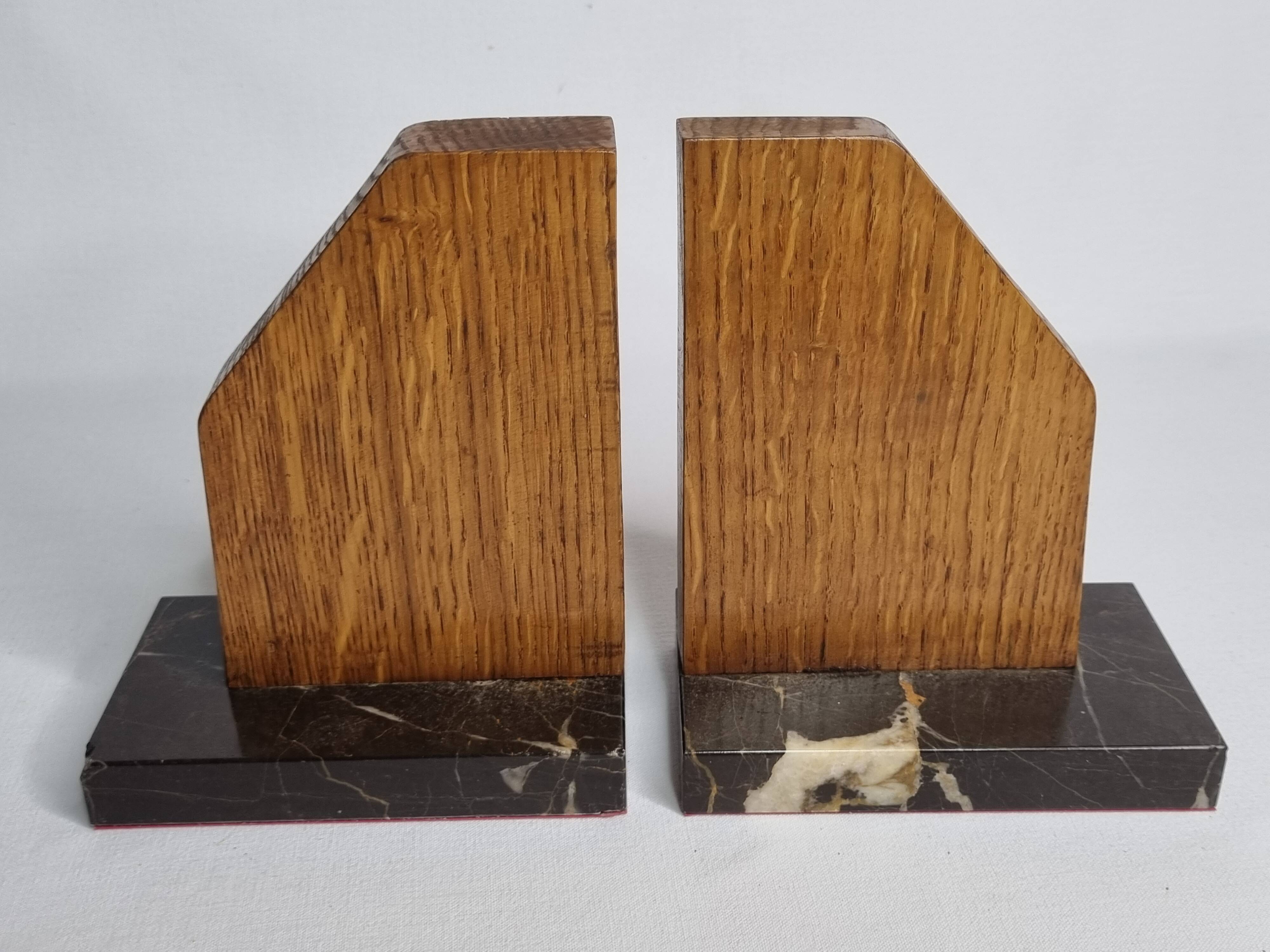 Pair of Art Deco bookends in solid wood and veined black marble