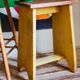 Art-populaire workshop stool in patinated painted wood