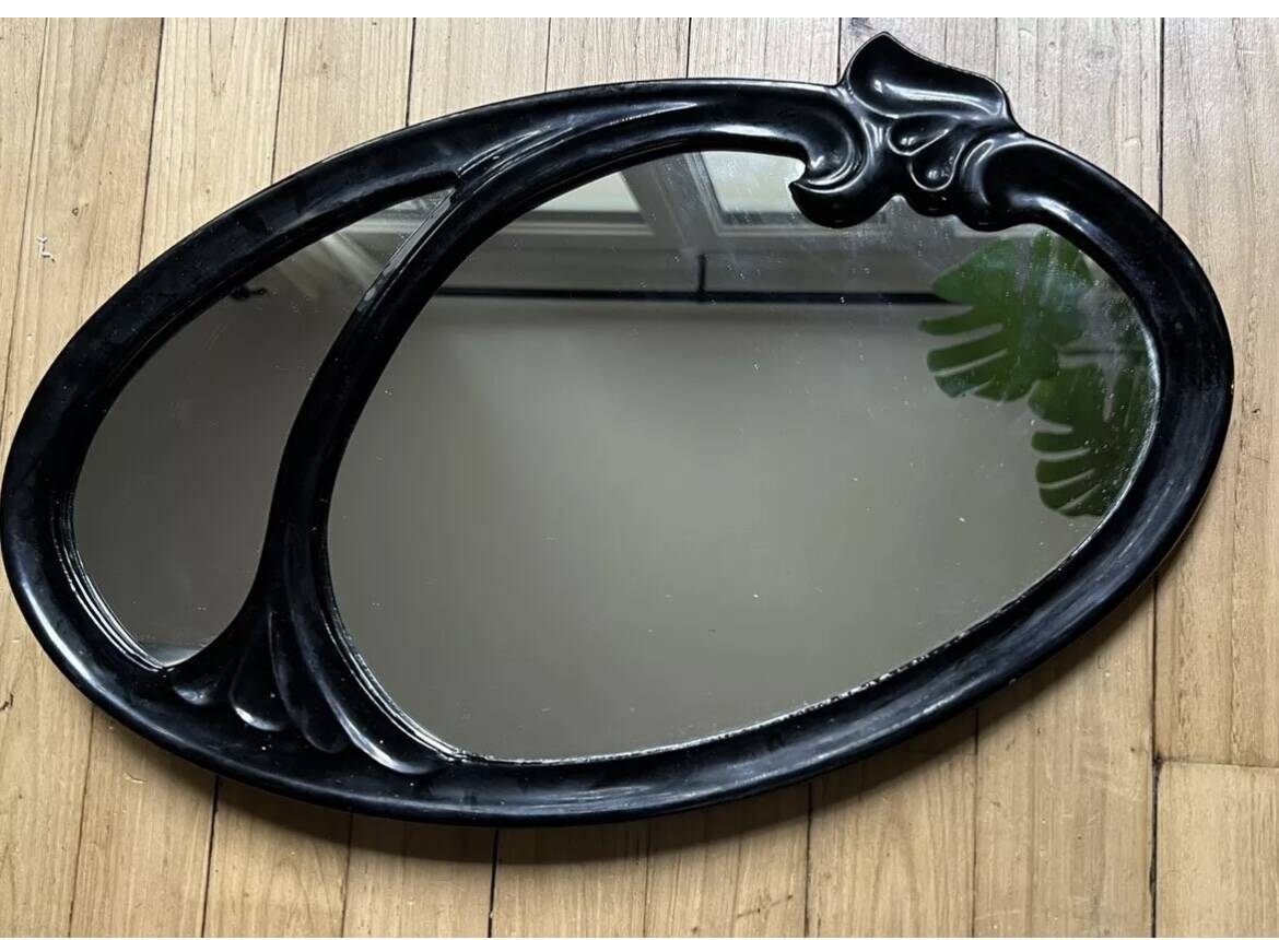 Oval cast steel mirror with Art Nouveau decor