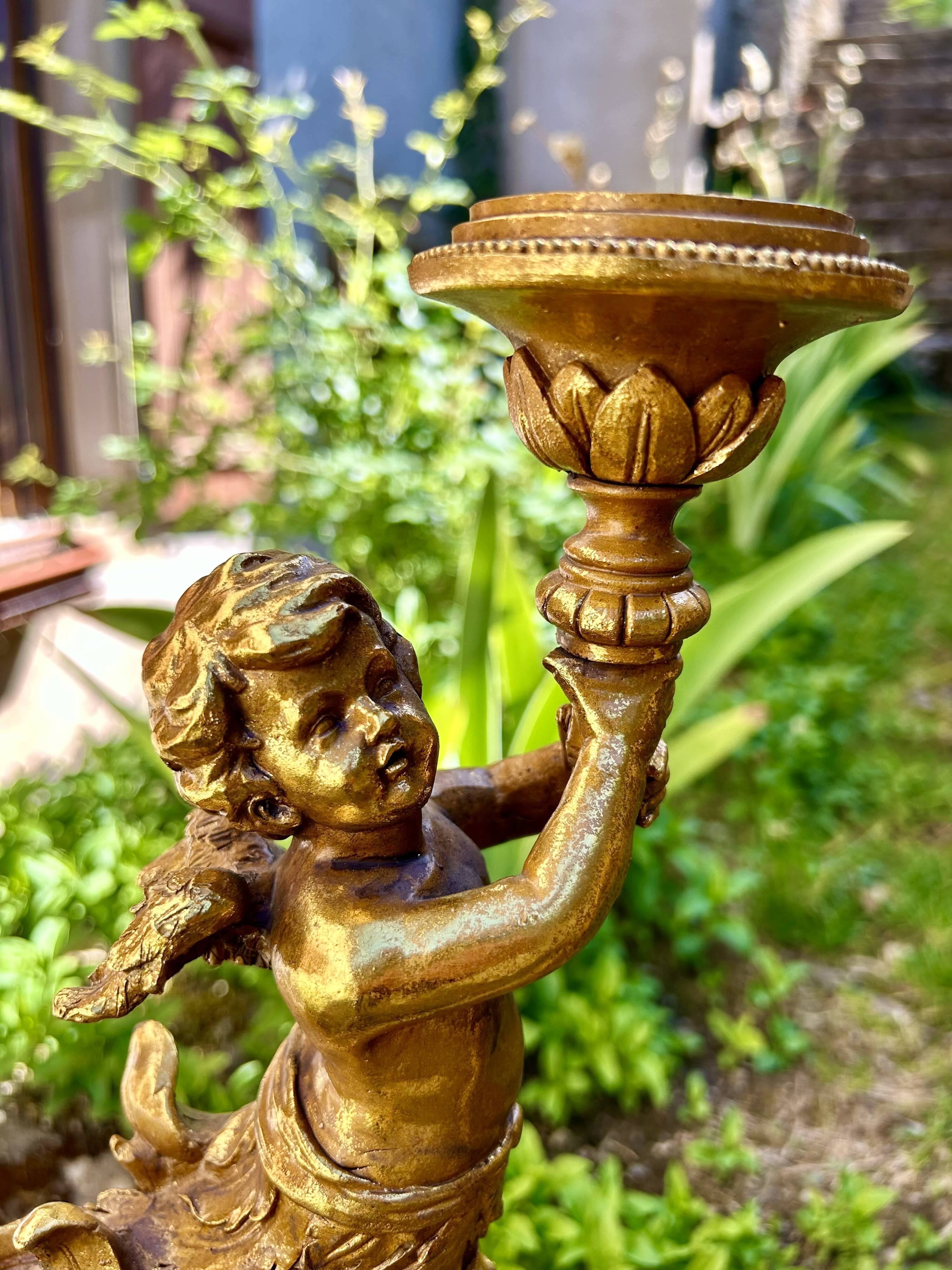 Pair of large candlesticks with cherubs