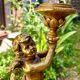 Pair of large candlesticks with cherubs