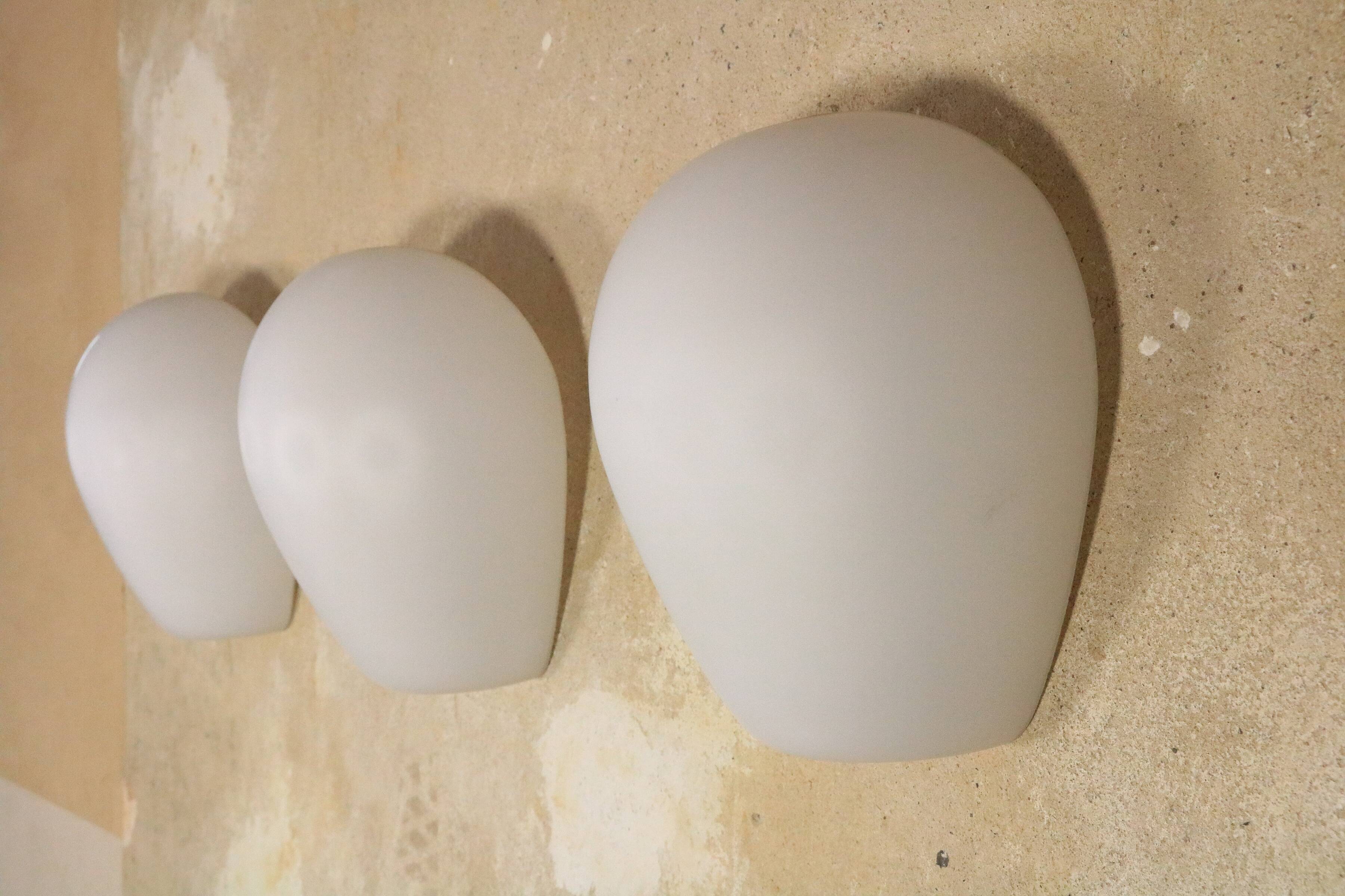 3 Wilhem Wagenfeld wall lamps, Peill & Putzler, "Muschel", 1950s