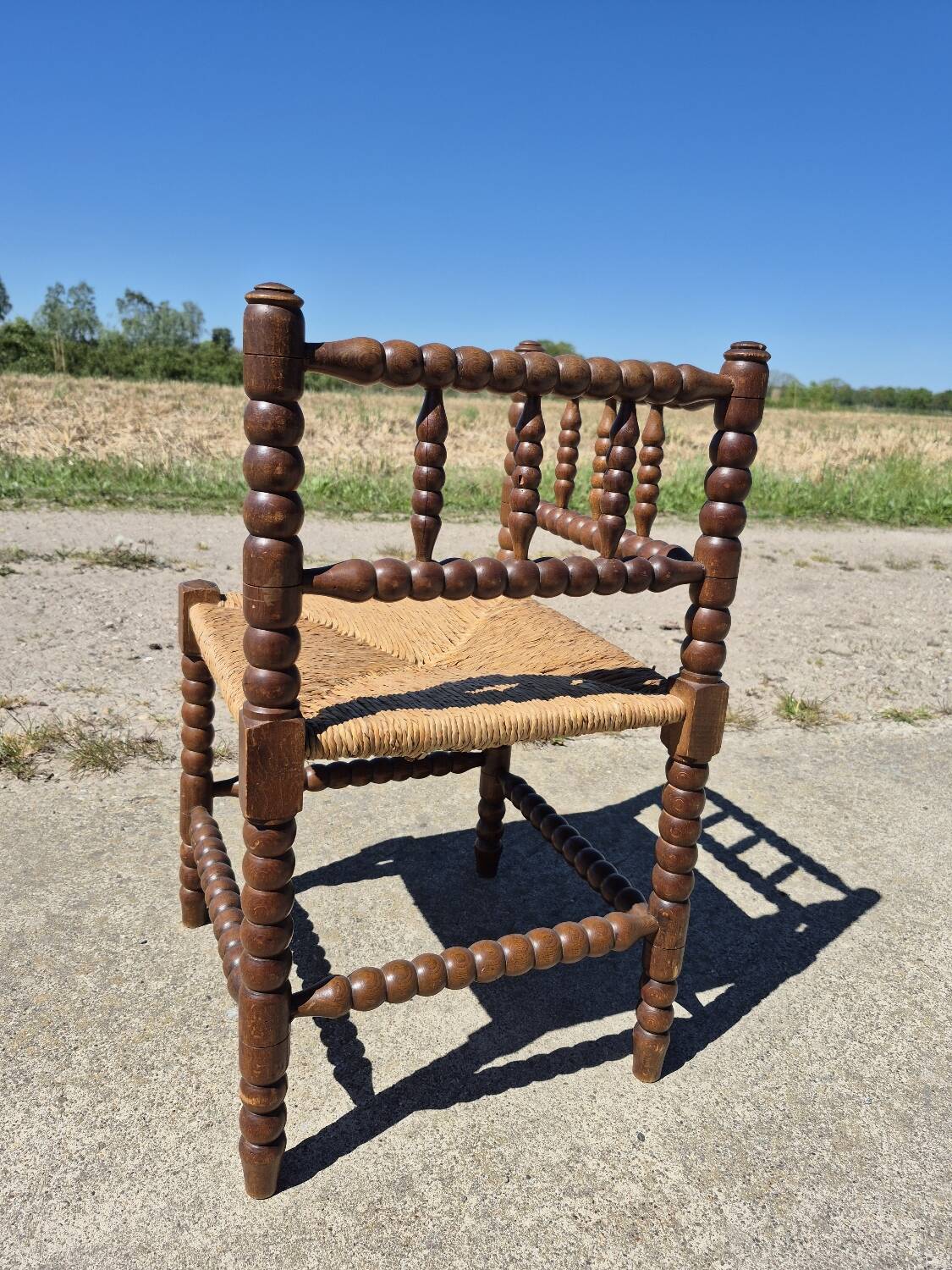 Vintage Dutch rustic corner chair bobbin turned oak with rush seating