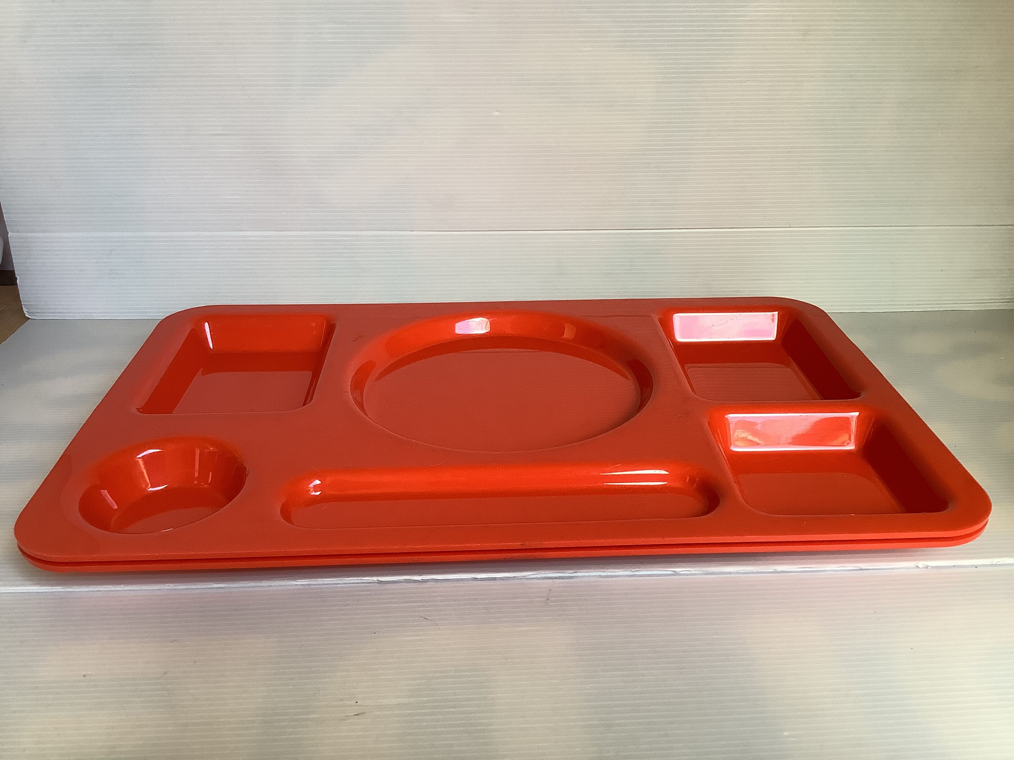 Pair of orange guzzini meal trays