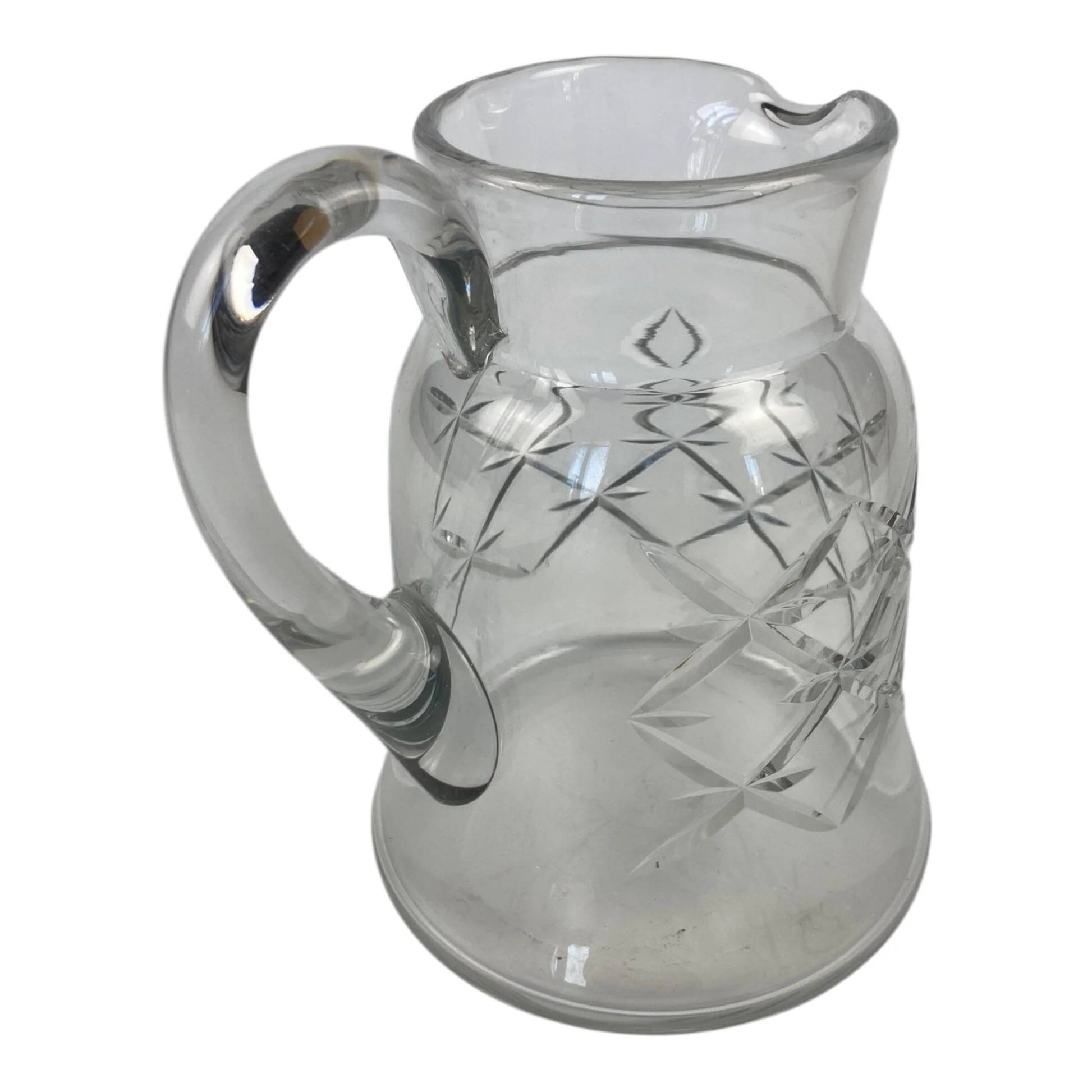 Antique Baccarat water jug in cut crystal with bevels.