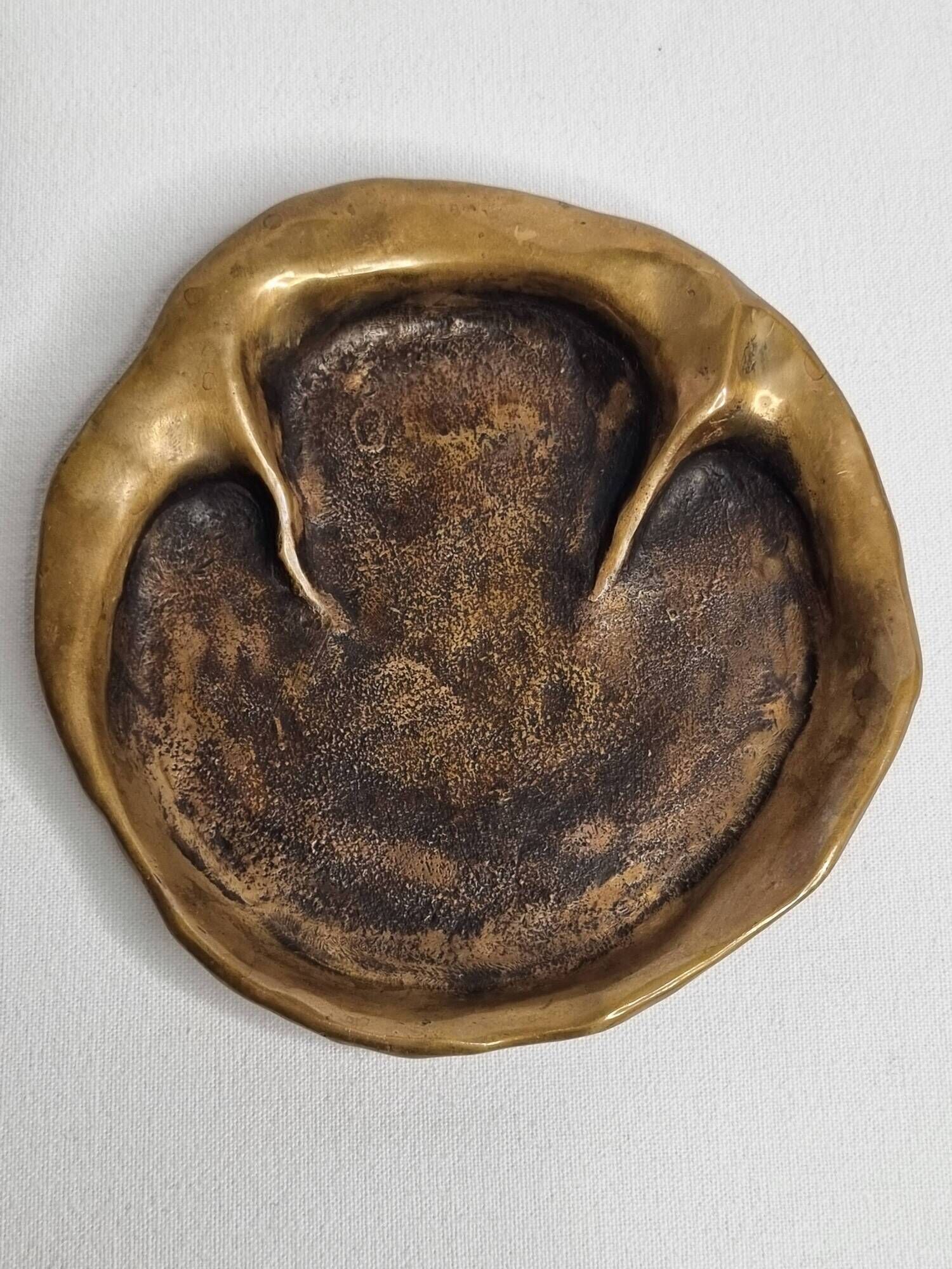 Bronze pocket emptier by Denis Mathews (1913-1997), "Rhinoceros Footprint" (12 cm), 1995