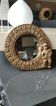 Shabby Chic round mirror. Putti/Cherub decor. Floral motifs. Dimensions: 20 x 20 cm.