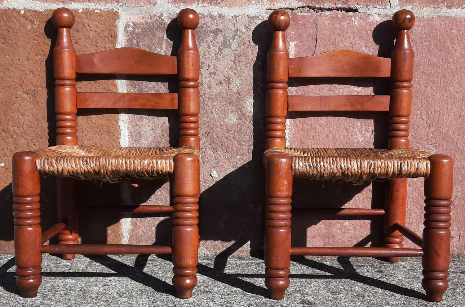 Pair of low armchairs by the fireplace. (Straw seat)