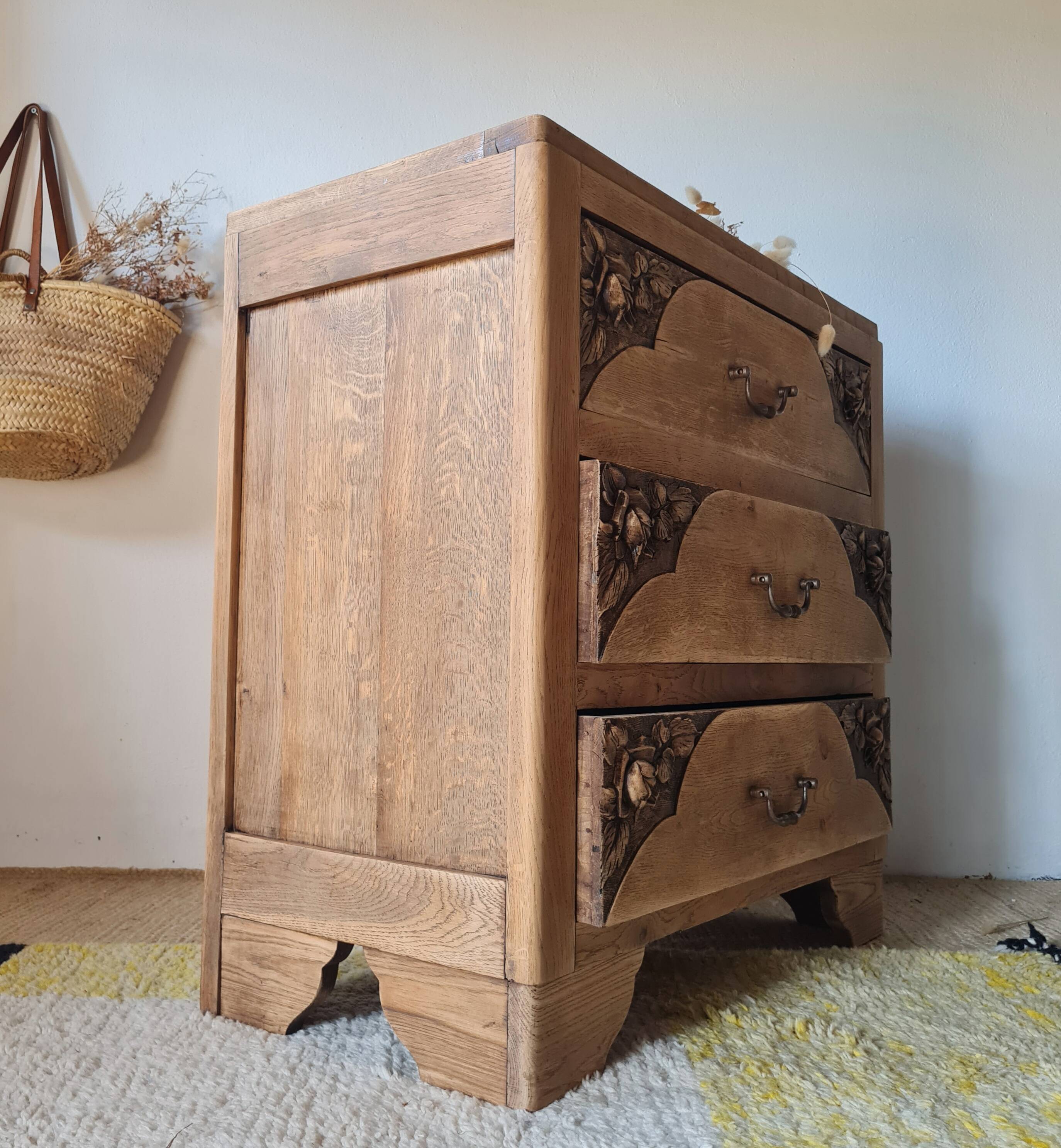 Art Deco chest of drawers in raw oak with carved drawers.