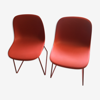 Red muuto "visu" chairs with sled base