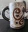 Chopped stoneware mug signed Dubois, vintage ceramic engraved with spirals, height 17cm.