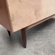 Teak sideboard with flap, 2 drawers and conical legs.