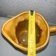 Antique pitcher with flower decoration
