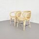 Paire de fauteuils en rotin et cannage
