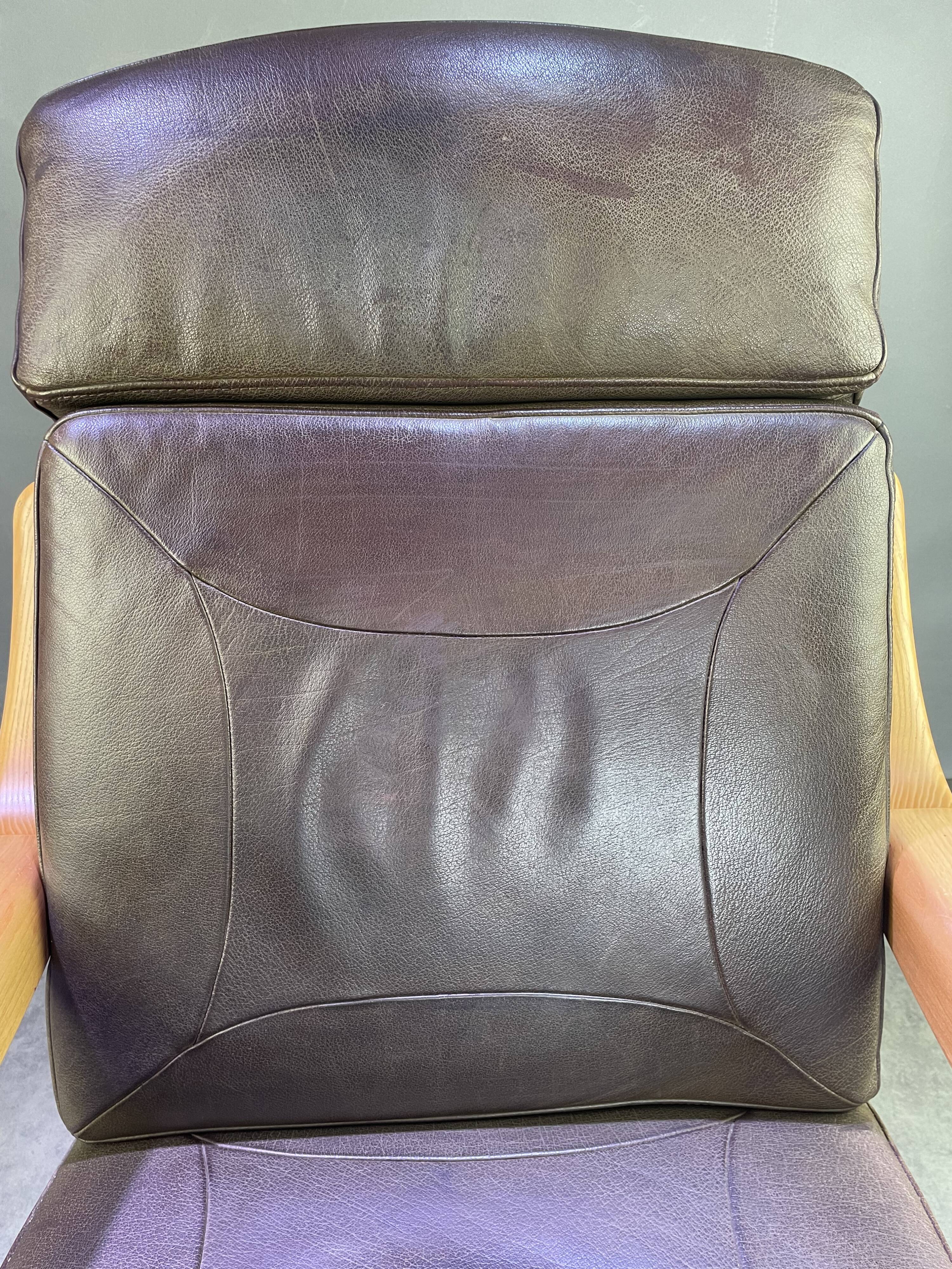 Chocolate leather armchair, wooden structure