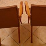 Pair of Art Deco armchairs in curved wood and brown leather – 1930s