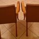 Pair of Art Deco armchairs in curved wood and brown leather – 1930s
