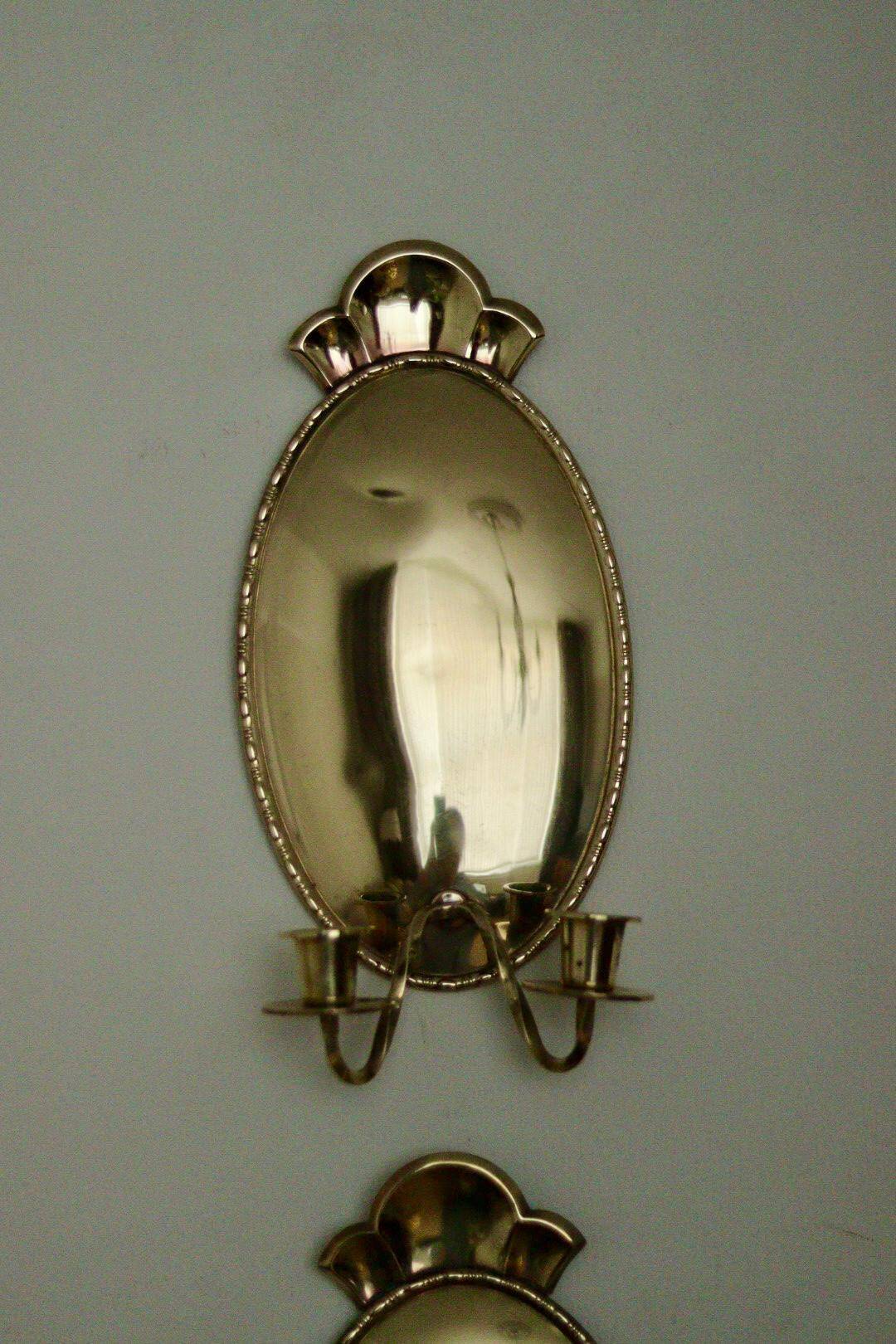 Pair of Swedish brass wall sconces from the mid-century.