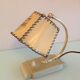 Brass bedside lamp and beige lampshade art deco style