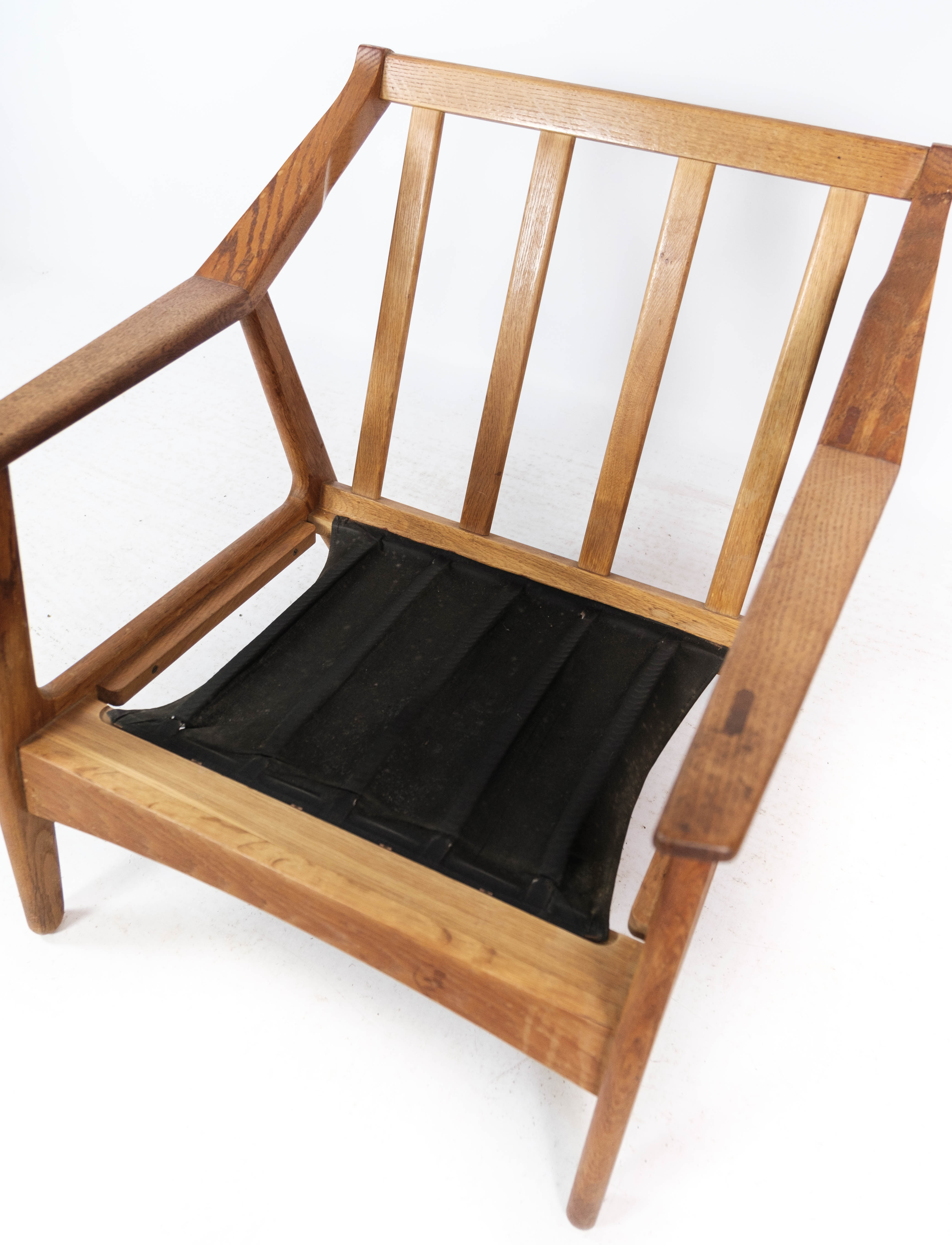 Armchair in oak and upholstered with red fabric, designed by H. Brockmann Pedersen, 1960s