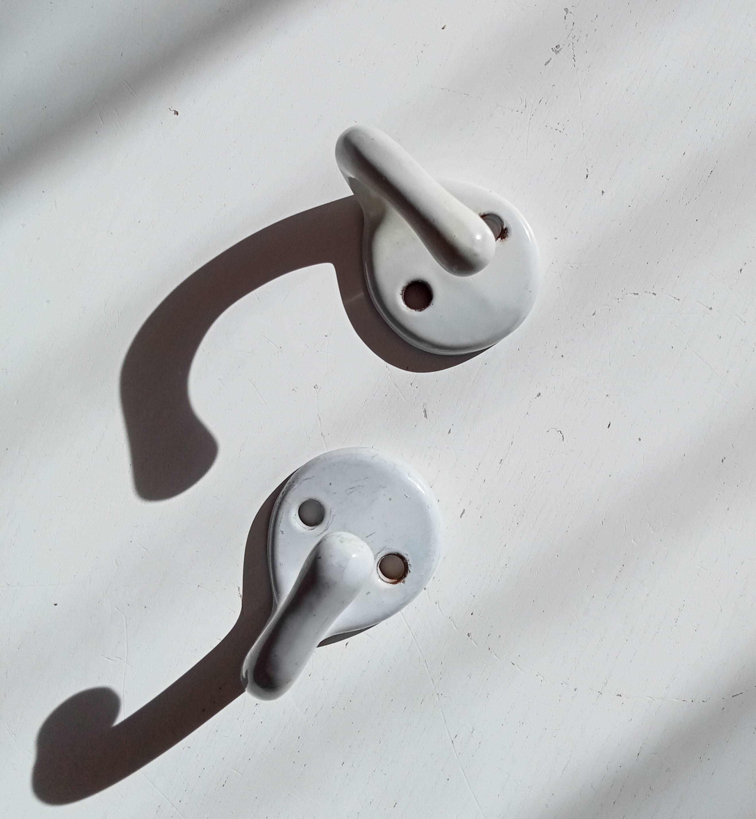 Antique enamelled cast iron wall hook from the 30s/40s