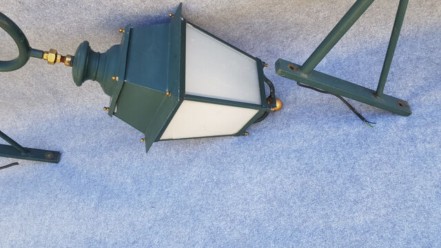 Pair of antique lanterns on its gallows