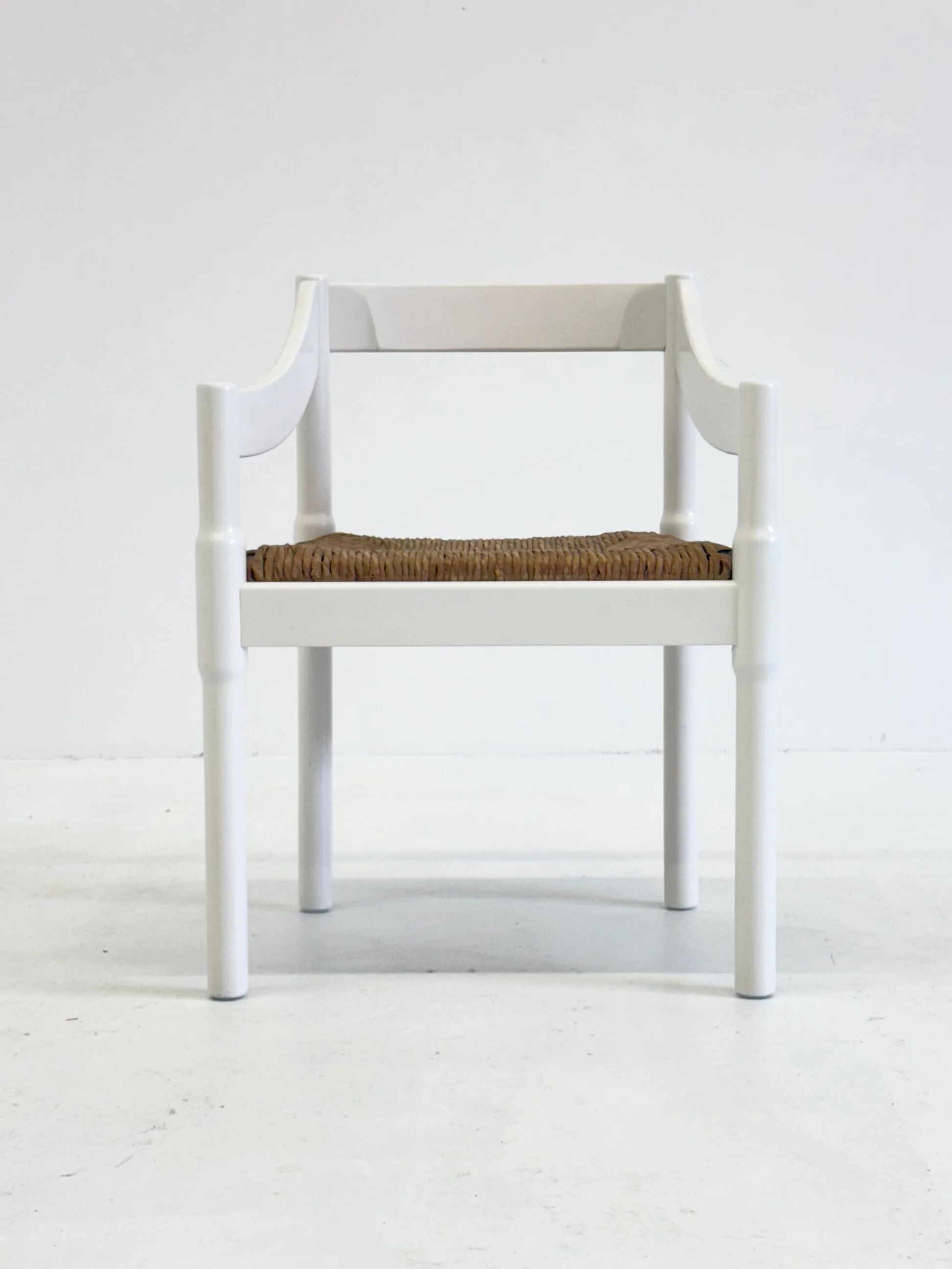Set of two Carimate chairs by Vico Magistretti in white
