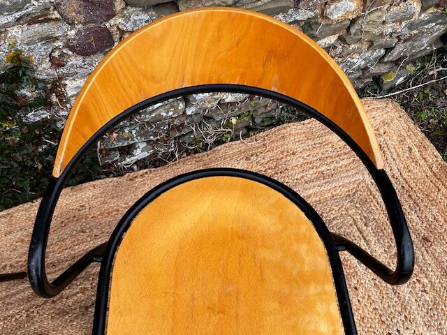 Pair of wooden and black metal chairs