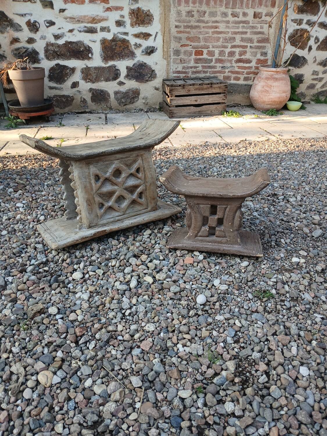 2 African carved wooden stools