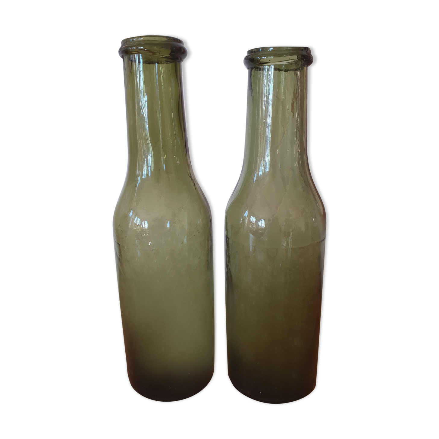 Pair of green bottles made of bubbled blown glass
