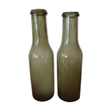 Pair of green bottles made of bubbled blown glass
