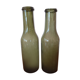 Pair of green bottles made of bubbled blown glass