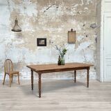 Vintage farmhouse table with turned legs.