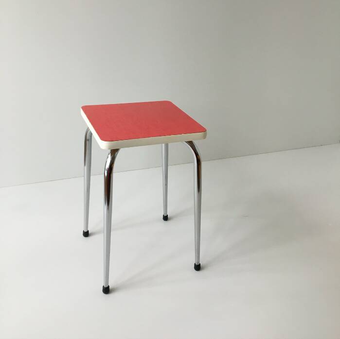 Stool in pinkish red formica