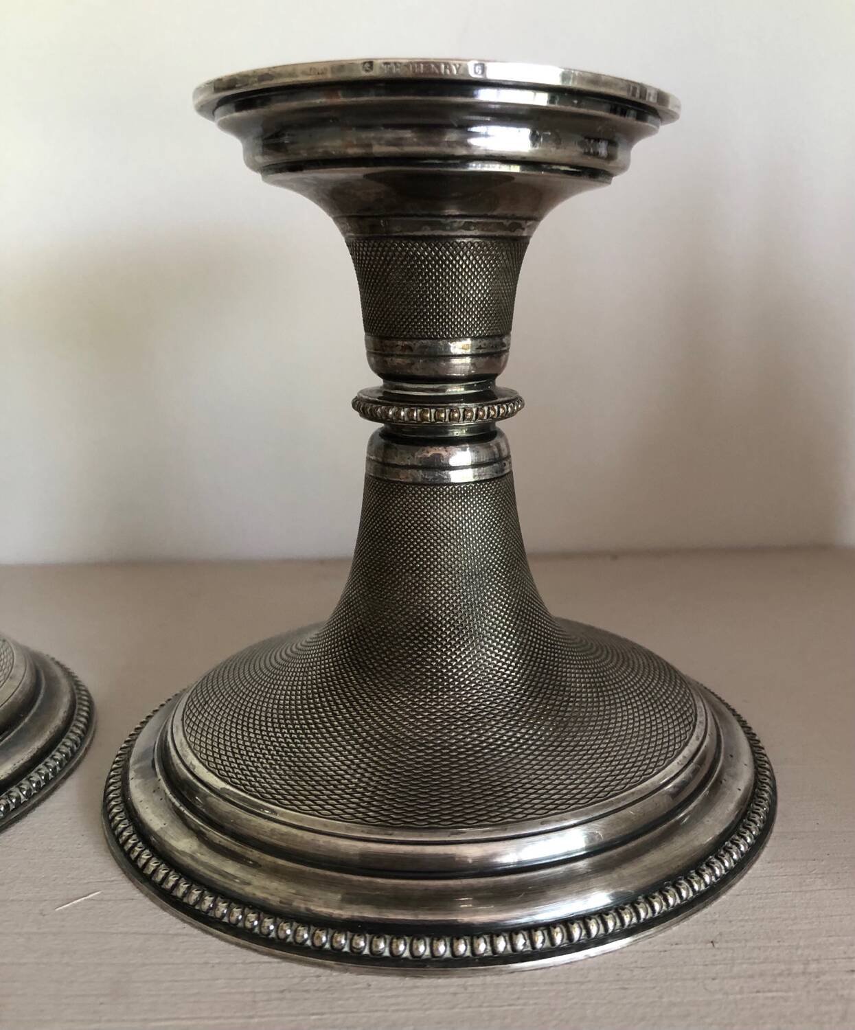 Silver candlesticks by TH HENRY