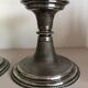 Silver candlesticks by TH HENRY