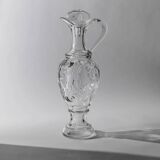 Vintage pressed glass carafe from the 1960s, clear sculptural glass with textured patterns and a stopper.