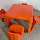 Table and 4 chairs in orange fiberglass design from the 70s Patrick Gingembre Paulus edition