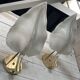 Set of 3 Murano glass wall lamps in white and brass, 1970s.