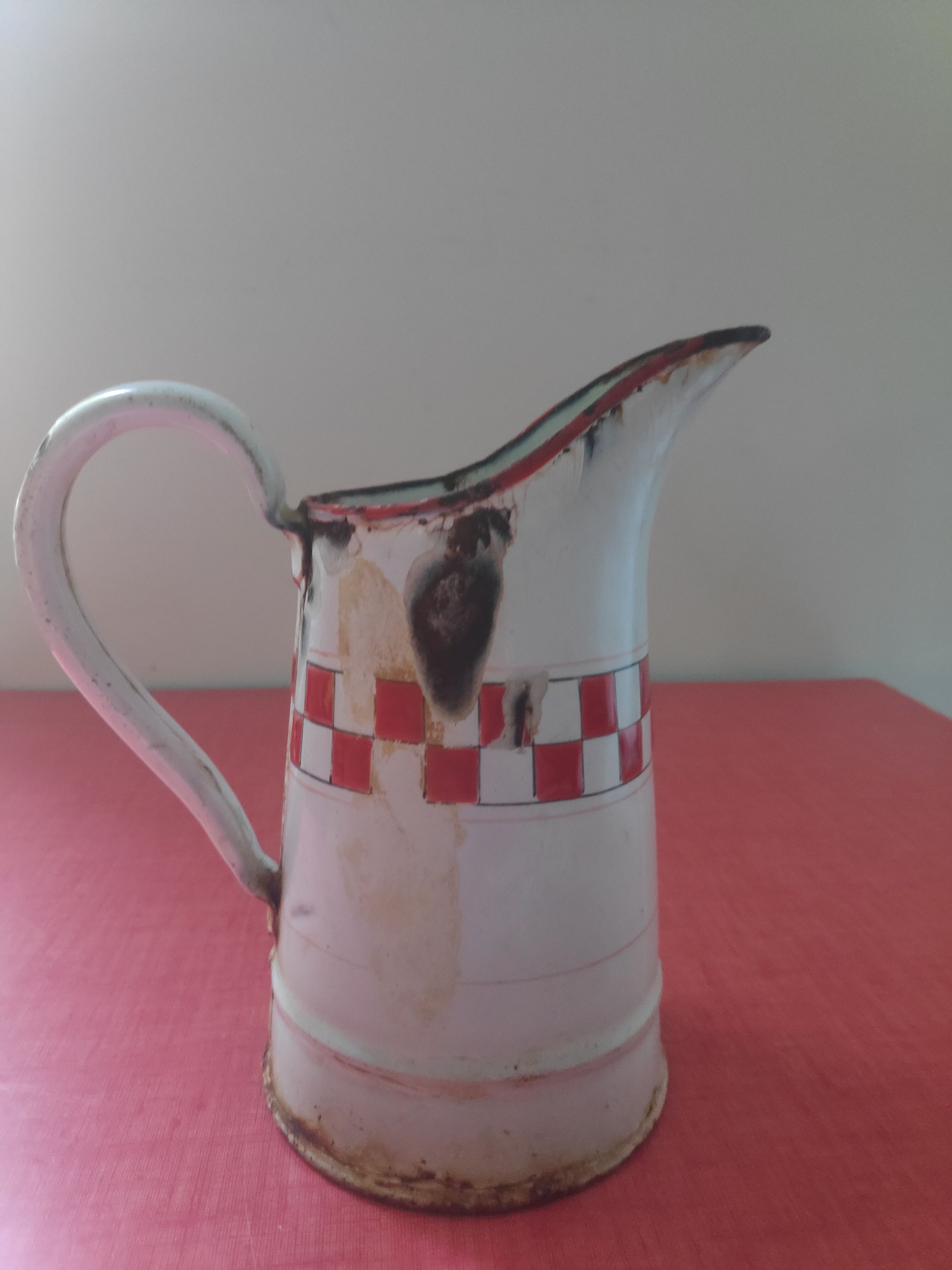Enamelled sheet metal pitcher Lustucru décor