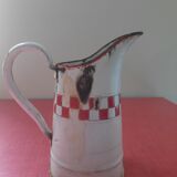 Enamelled sheet metal pitcher Lustucru décor