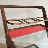 Rolling table made of wood, brass and glass